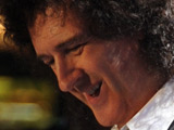 Brian May performing at Nelson Mandela's 90th Birthday concert