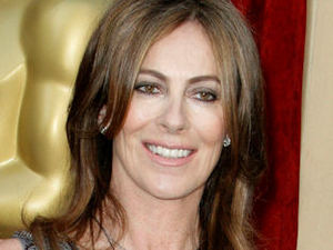 Director Kathryn Bigelow gleaming for the photographers as she walks the Oscars red carpet