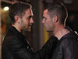 Aaron and Jackson share a moment in the street.