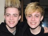 John and Edward (‘Jedward’) Grimes pose for pictures with fans outside of the London May Faire Hotel