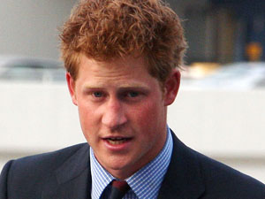 Prince Harry speaking on the flight deck of the Intrepid Sea, Air & Space Museum during a reception for U.S. and British veterans and their families.