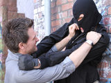 Malachy wrestles with a masked thief
