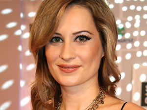 Camille Sullivan signs for 'Roo...