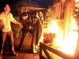 Andy and Carl shout for Katie as the fire is spreading quickly