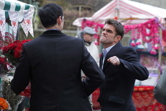 In the market, Jane is talking to Michael as Jack appears and punches him.