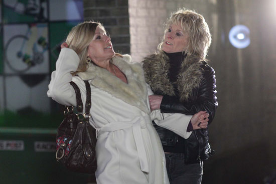 As Glenda is walking, Shirley comes out of the shadows and drags her up.