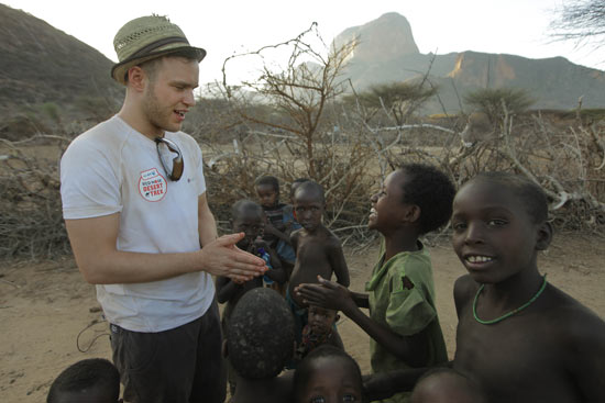 Olly Murs with local children