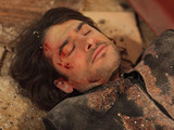 Syed is lying injured on the floor in the Argee Bhajee.