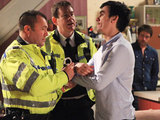 The police arrest Cain whilst Debbie looks angirly at Cameron