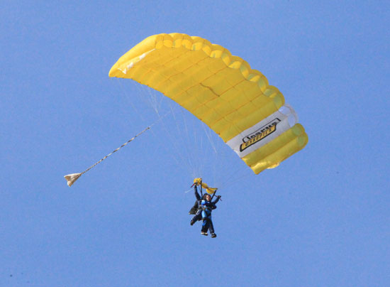 Aaron and Hzael look on as Jackson does a sky dive