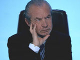 Lord Alan Sugar in The Apprentice boardroom
