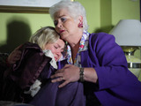 Janine tries to resist Pat's hug at first but gives in as Pat dismisses Billy and Yusef.