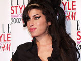 Amy Winehouse holds her Best British Music Act award, during the Elle magazine awards in London, 2007.