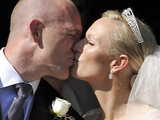 Zara Phillips and her new husband Mike Tindall kiss outside Canongate Kirk in Edinburgh.