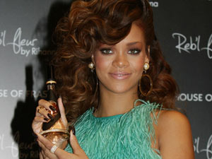 Rihanna is pictured during a photocall to launch her fragrance Reb'l Fleur, at House of Fraser on Oxford Street, London