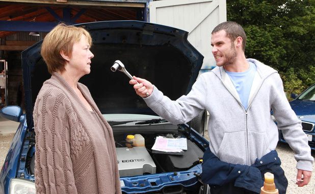 Aaron Livesy (Danny Miller) threatens Hazel Rhodes (Pauline Quirke)