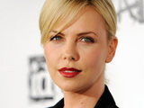 Charlize Theron poses at the official launch party for the video game "Rage