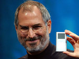 Steve Jobs displays the iPod mini at the Macworld Conference and Expo, San Francisco, 2004