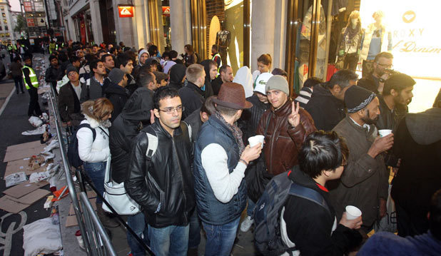 People queue at the Apple Store in Regents Street, London