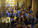 Staff at the Apple store in Covent Garden, London, to open as the iPhone 4S goes on sale