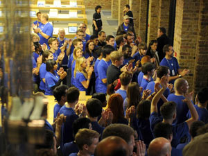 Staff at the Apple store in Covent Garden, London, to open as the iPhone 4S goes on sale