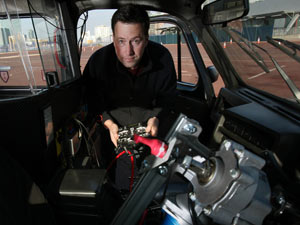 Dr James Brighton and Colin Murray unveil the world's first remote controlled black cab in London