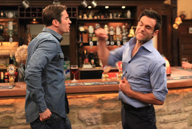 Nikhil Sharma (Rik Makarem) punches Nicky Pritchard (Matt Milburn)