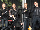 Westlife perform on stage during Ladies Day at Newbury Races, Berkshire