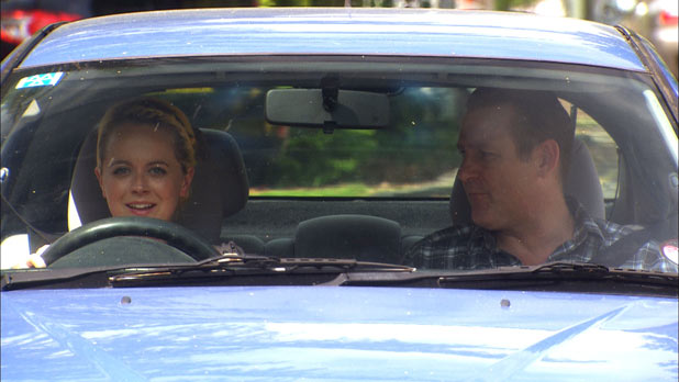 Karen Hollins (Jan Pearson) and Rob Hollins (Chris Walker) try to teach Imogen Hollins (Charlie Clemmow) how to drive