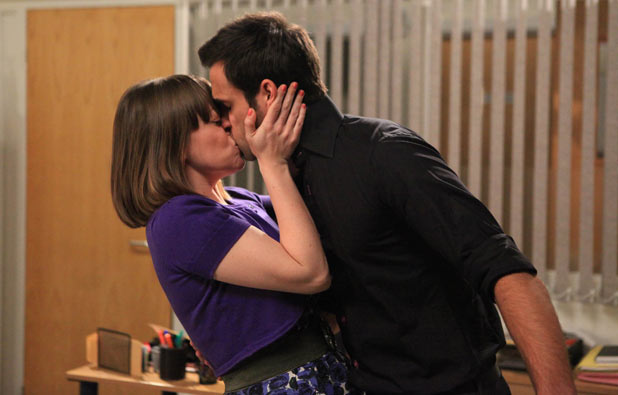 Gennie Walker (Sian Reese-Williams) and Nikhil Sharma (Rik Makarem) kiss