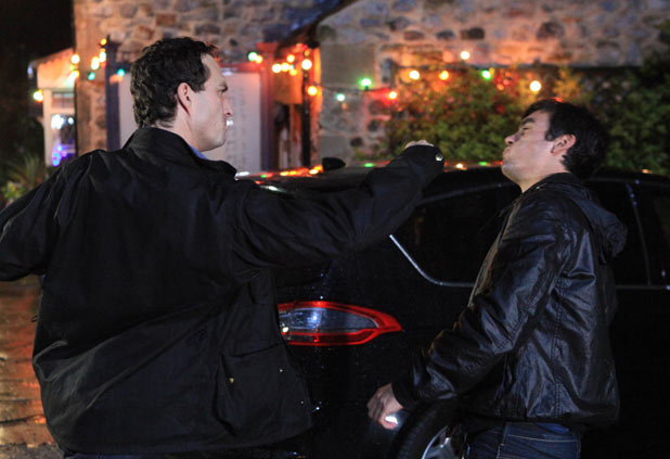 John Barton (James Thornton) punches Cain Dingle (Jeff Hordley)