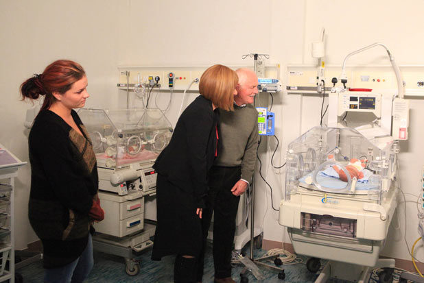 Val, Eric and Amy visit the baby