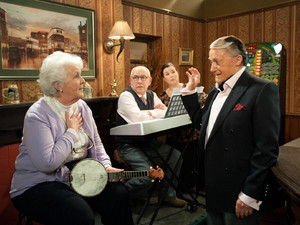 Sylvia is about to start her music contest with Norris when she is delighted to see Milton appear beside her