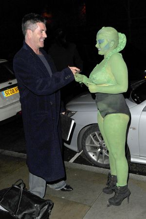 Simon Cowell meeting 18-year-old fan Shauna Wardle, who was covered in green body paint