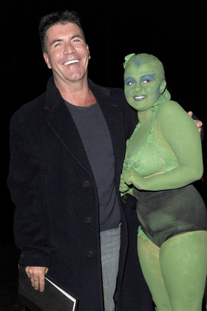 Simon Cowell meeting 18-year-old fan Shauna Wardle, who was covered in green body paint