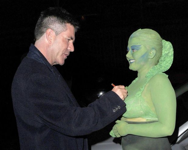 Simon Cowell meeting 18-year-old fan Shauna Wardle, who was covered in green body paint