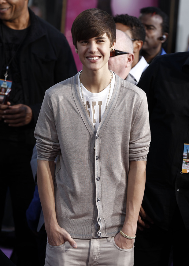 Justin Bieber poses for a photo during the hand and footprint ceremony honoring musician Michael Jackson