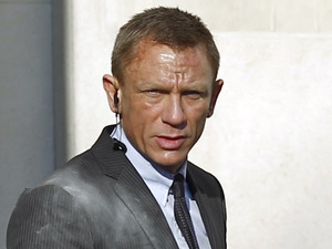 James Bond Skyfall set pictures: Daniel Craig with an earpiece.