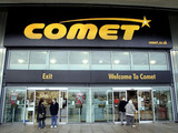 Shoppers outside a Comet store