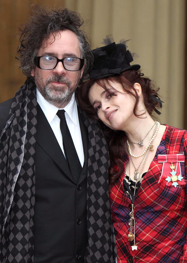Helena Bonham Carter and her husband Tim Burton pose with her Commander of the British Empire (CBE) medal, after an Investiture ceremony at Buckingham Palace