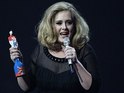 Adele collects the British Female Solo Artist award on stage during the 2012 Brit awards at The O2 Arena, London