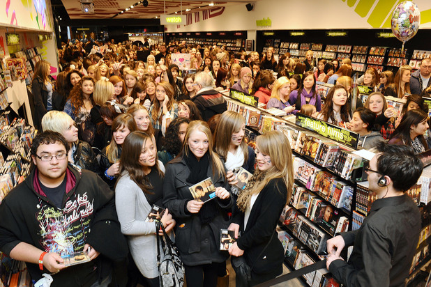 Fans wait to meet Justin Bieber at HMV in Westfield Shopping Centre, London. Jan 2010