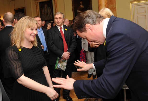 Prime Minister David Cameron bows to actress Joanna Page, who plays Stacey in the TV comedy show Gavin and Stacey