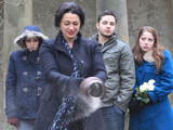Moira and the Bartons scatter John's ashes. The Barton's are unaware that Holly has pocketed her heroin before leaving