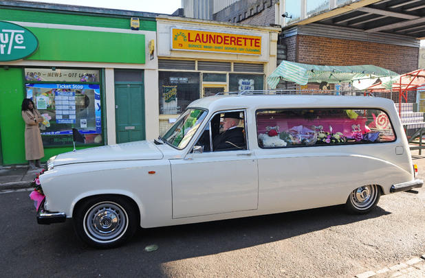 Heather's hearse arrives in the square.