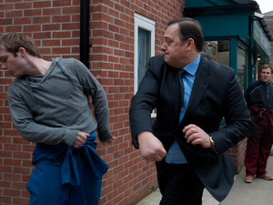 Tyrone rushes over to break the fight up as Tommy brawls with the other man