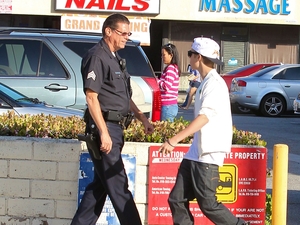 Justin Bieber is asked by a Los Angeles police officer to move his £60k Fisker Karma ­electric car with customized chrome paint work which was illegally parked outside shops
Beverly Hills, California