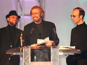 Robin, Barry and Maurice Gibb, accept the Brit Award for Outstanding Contribution in 1997