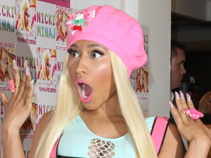 Nicki Minaj signs copies of her new album 'Pink Friday: Roman Reloaded' at HMV