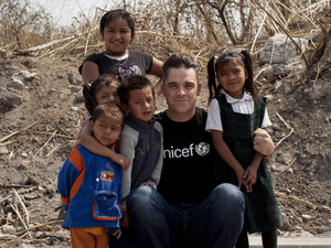 Soccer Aid England captain Robbie Williams meets children living in slums in Mexico City